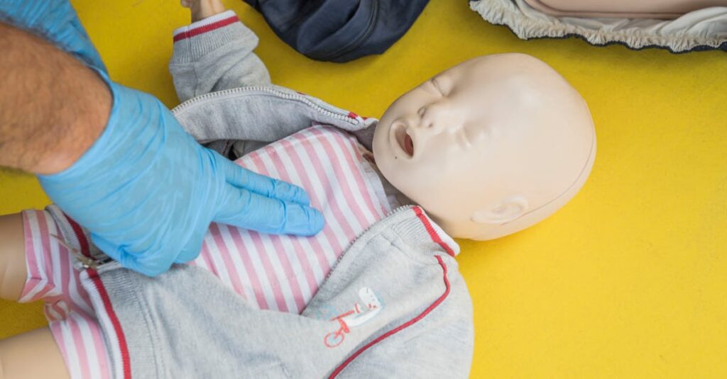pexels-photo-28271070-28271070 A person demonstrates infant CPR on a manikin, highlighting first aid techniques.